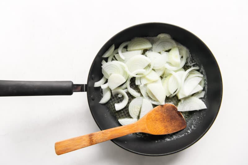 cooking onions in a skillet