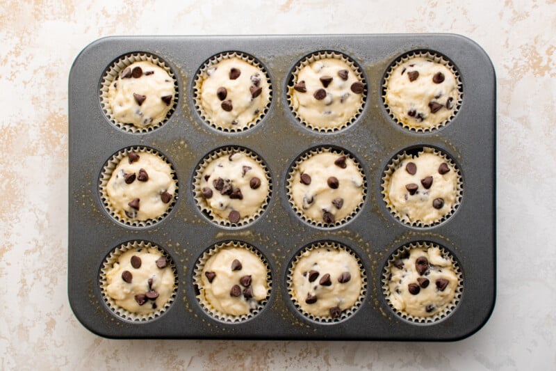 muffin tin filled with pancake batter