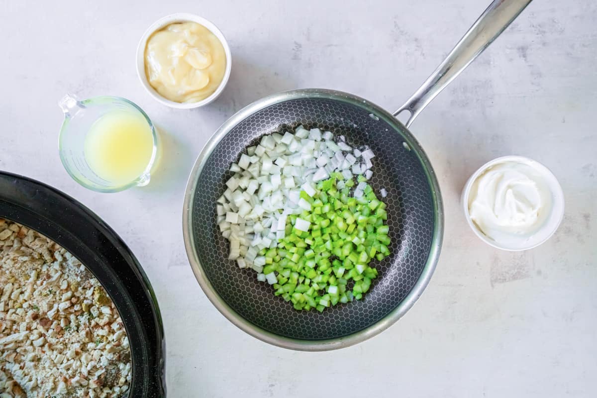 Onion and celery in a frying pan. - 7