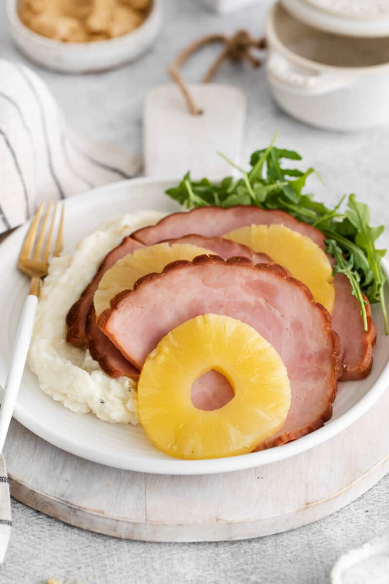 instant pot pineapple brown sugar ham on a white plate.