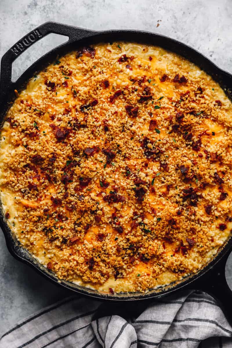 loaded mac and cheese in a cast iron skillet