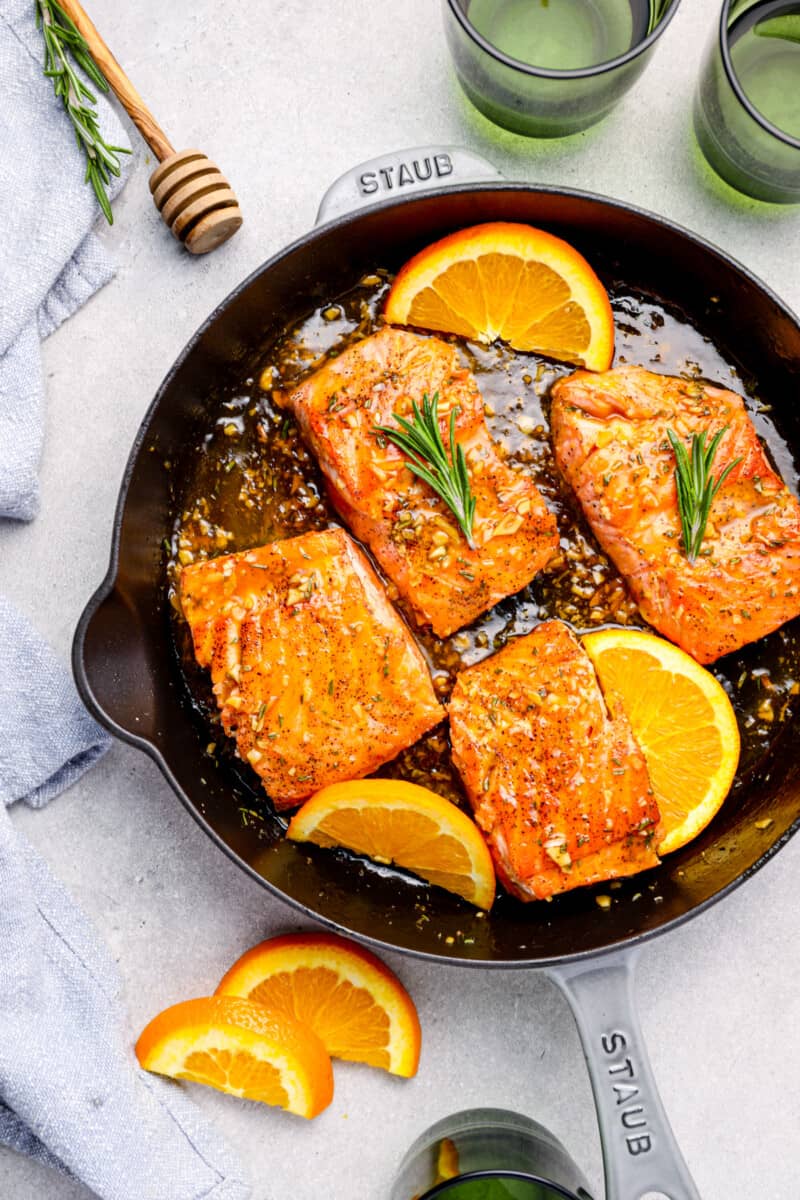 orange glazed salmon in a skillet