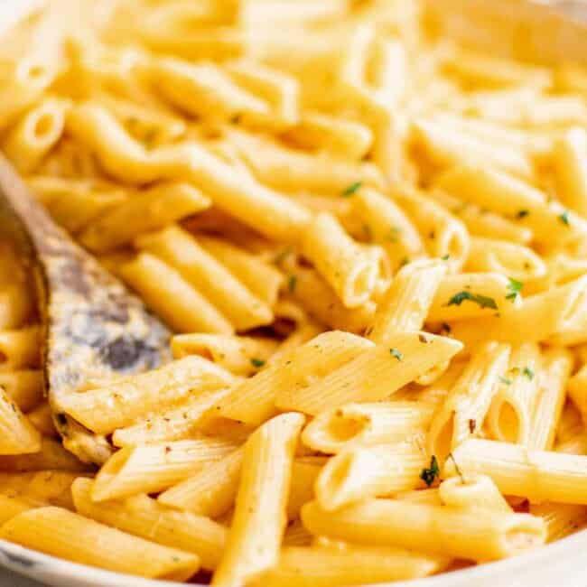 large serving bowl full of penne alla vodka pasta