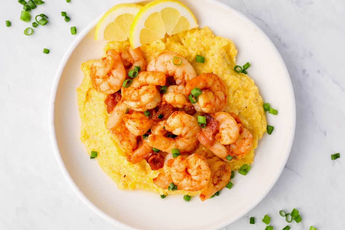 finished shrimp and grits served on a plate