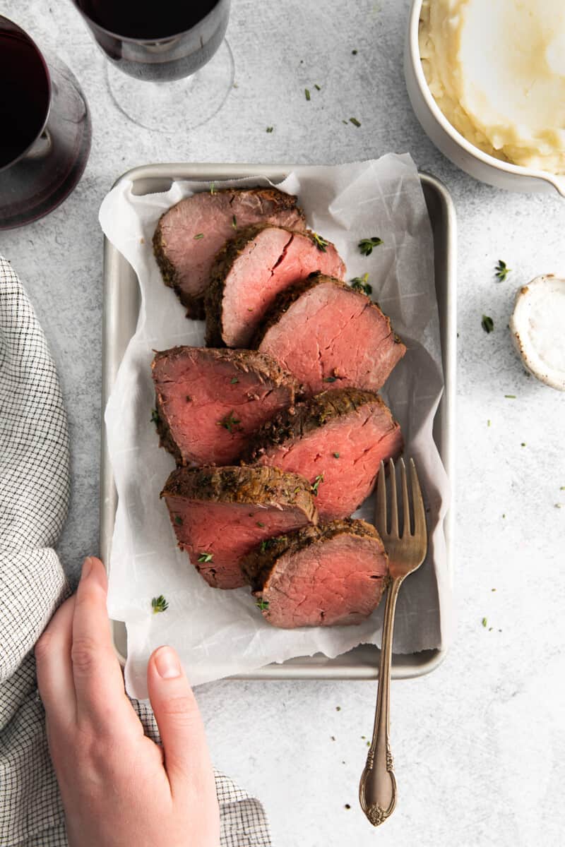 sliced of air fryer beef tenderloin on a tray