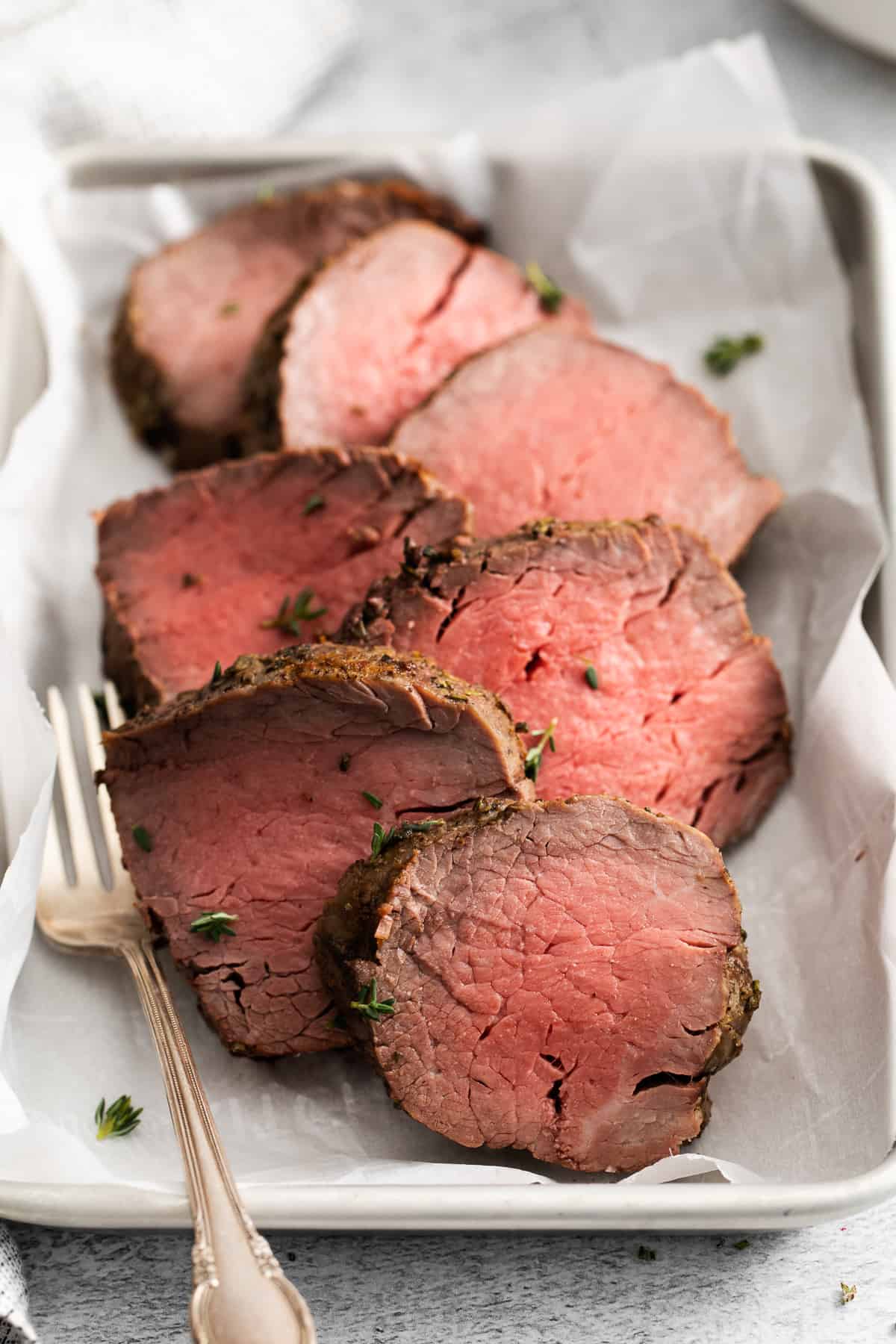 sliced of beef tenderloin on a tray