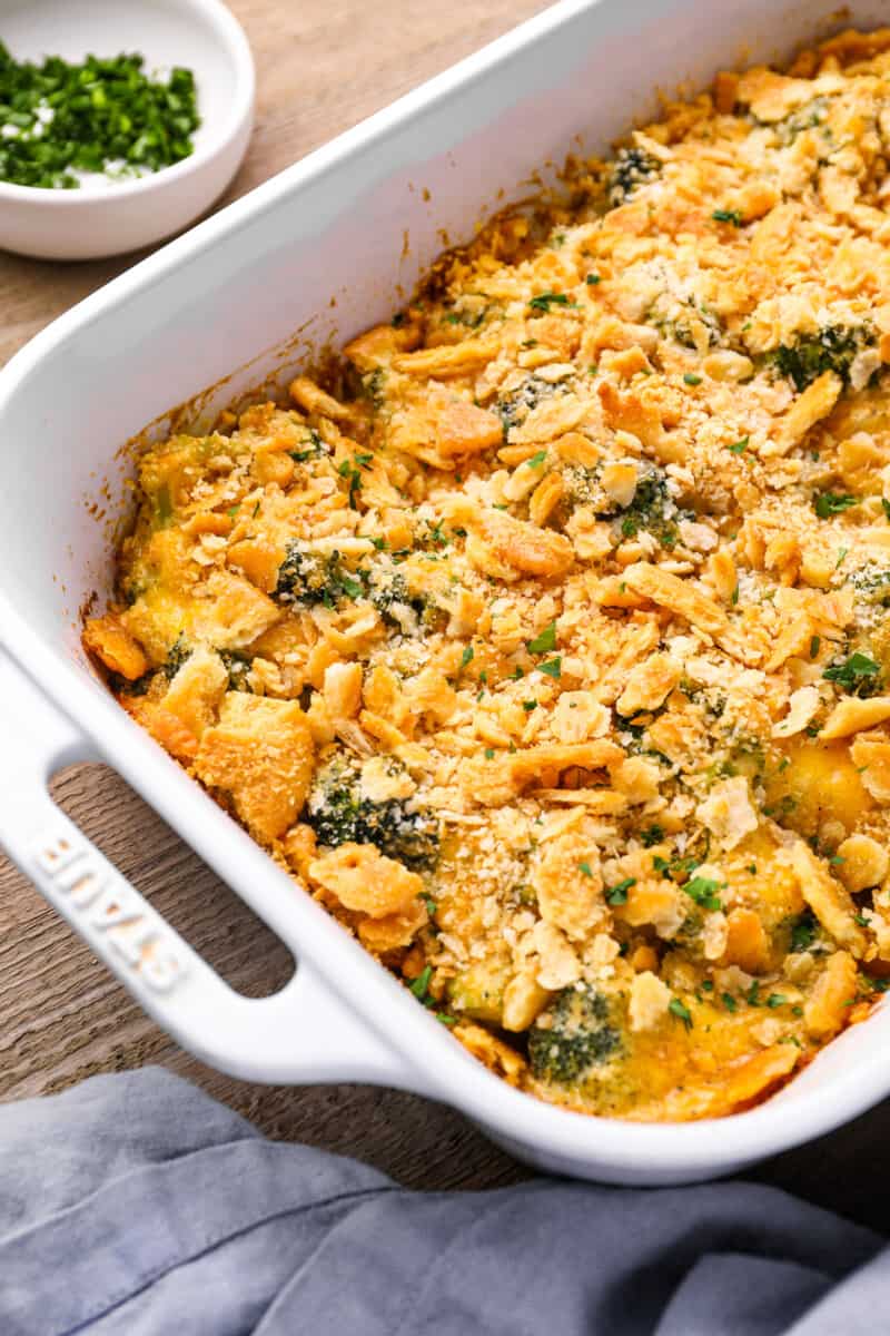 broccoli cheese casserole in a white baking pan.