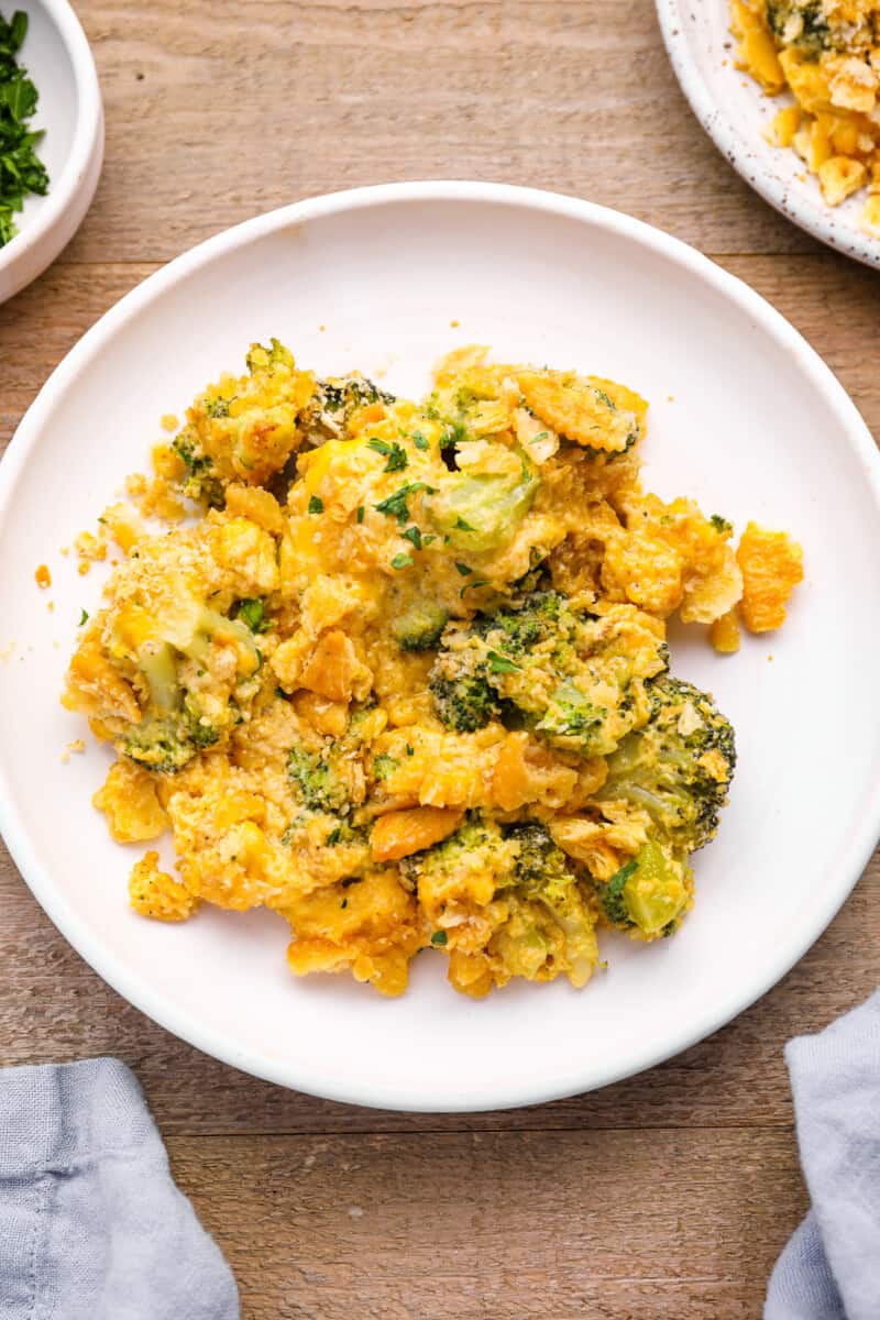 broccoli cheese casserole on a white plate.