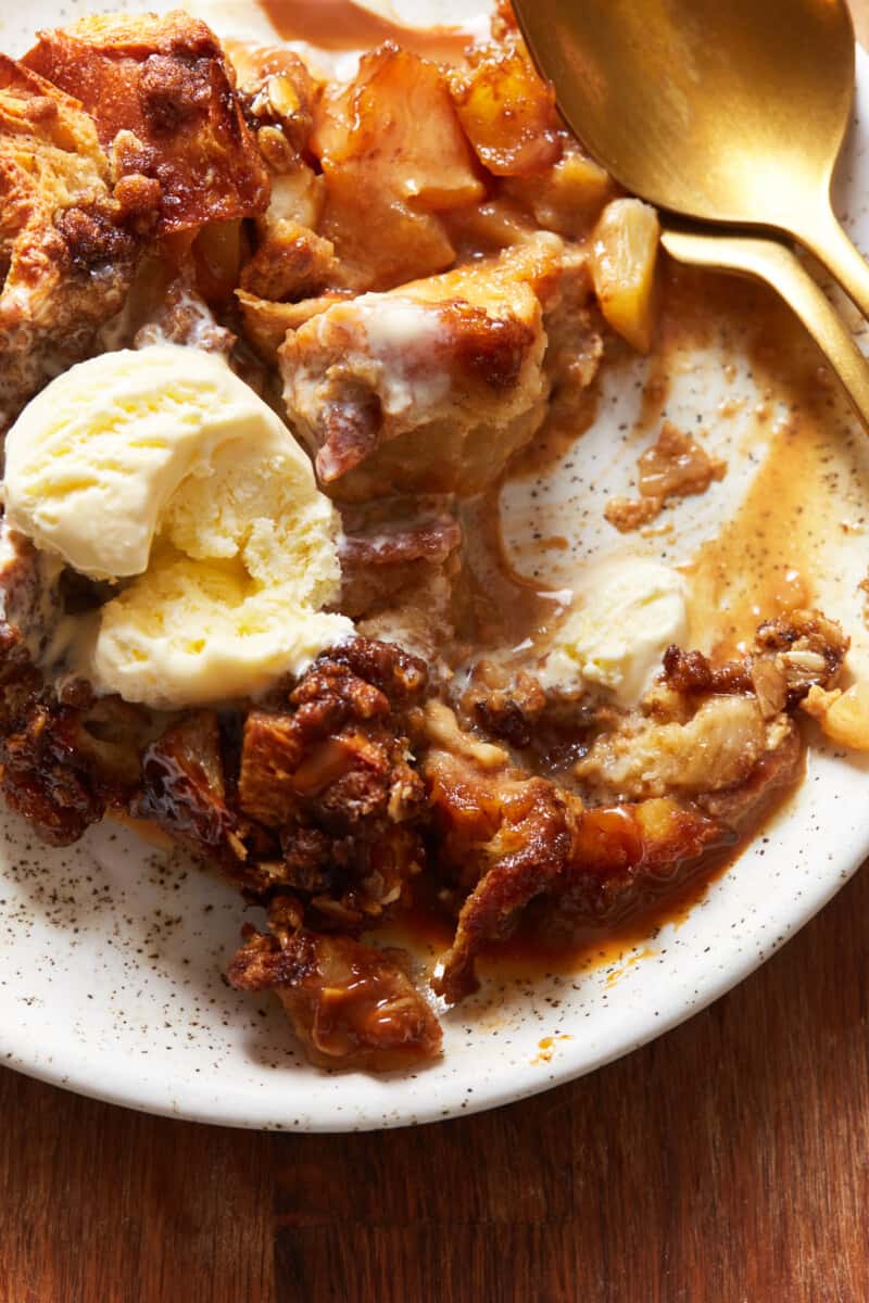 close up on a plate of caramel apple pie bread pudding