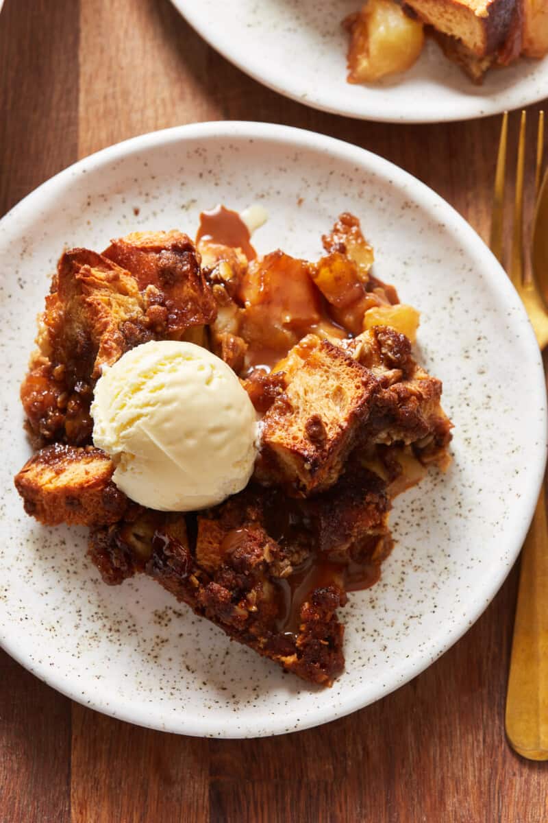 a plate of caramel apple bread pudding