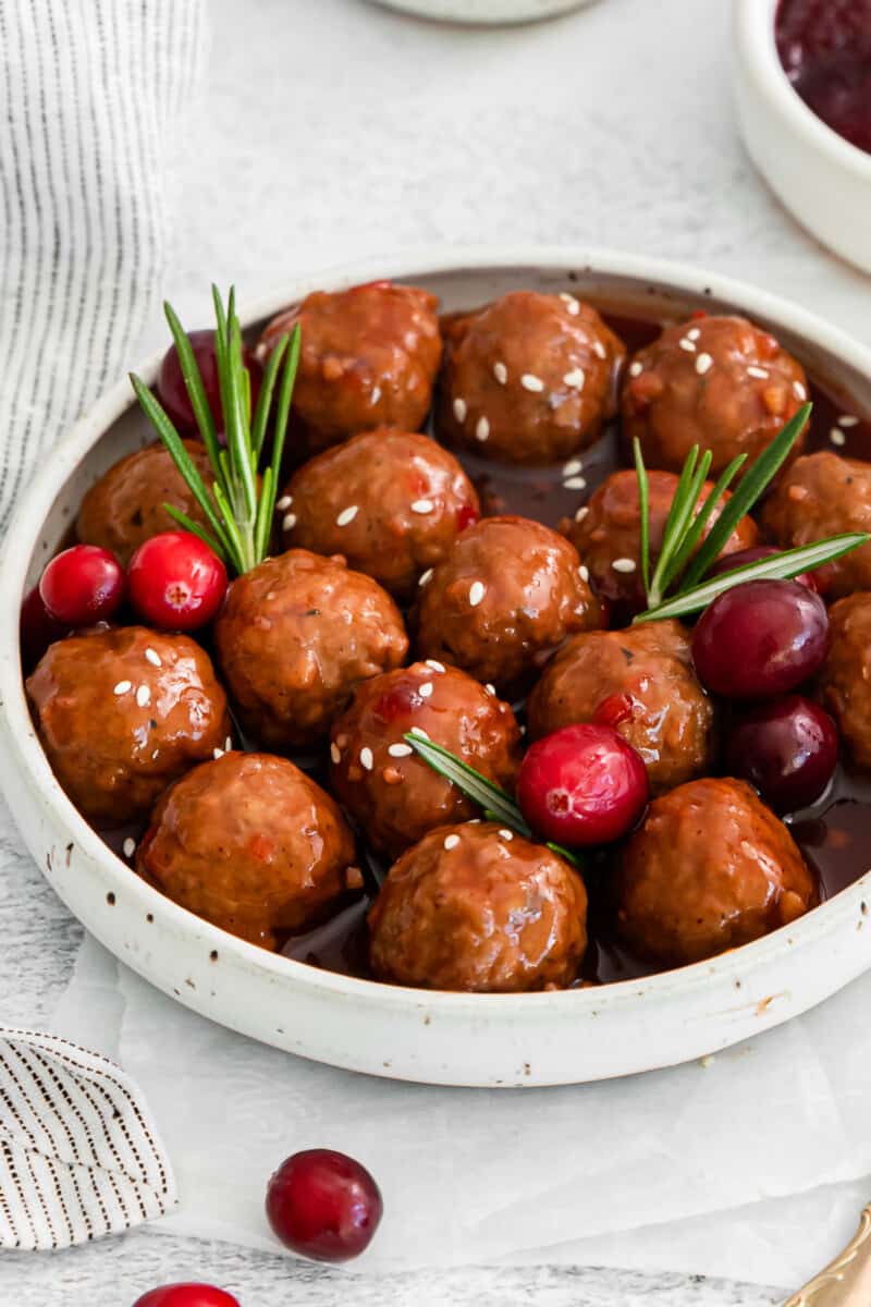 serving bowl filled with cranberry cocktail meatballs