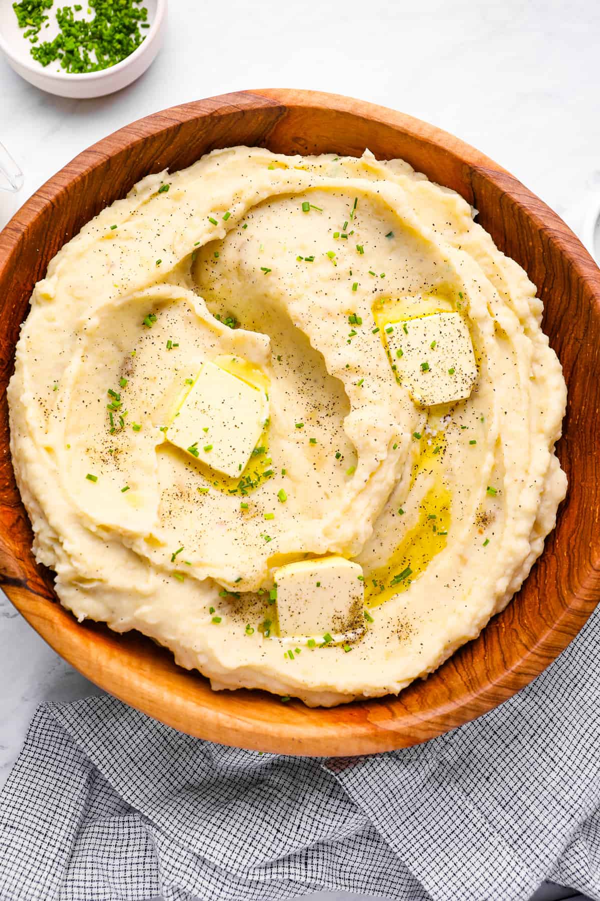 crockpot mashed potatoes with pats of butter