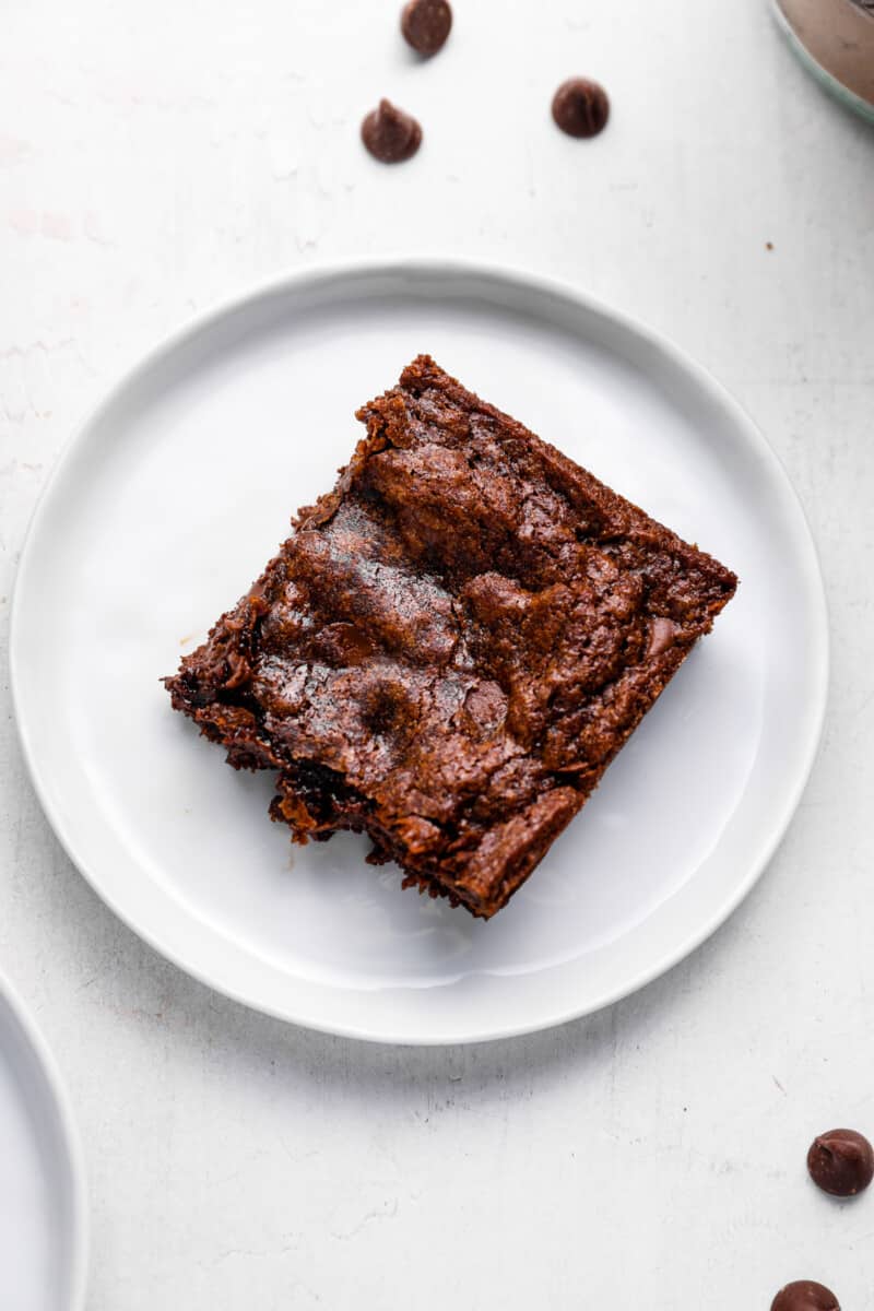 a brownie on a white plate.