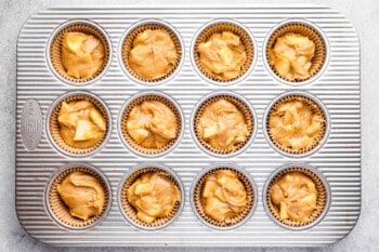 apple mixture in cupcake liners, before baking