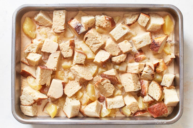 pieces of bread arranged in pudding mixture