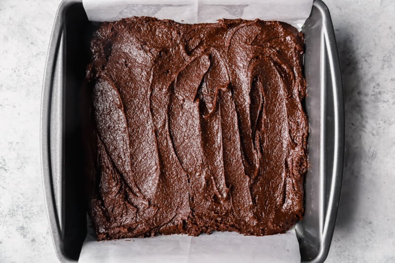 cosmic brownie batter in a parchment lined baking pan.