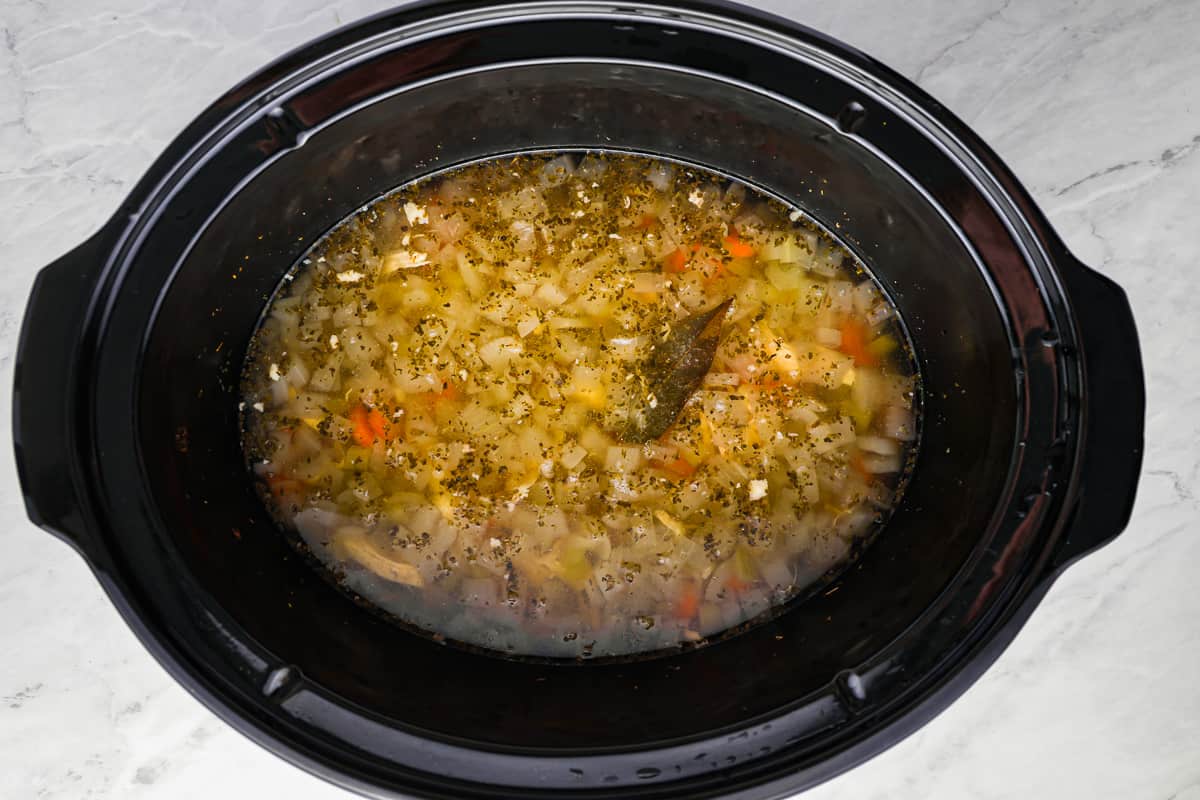egg noodles and soup in a crockpot.