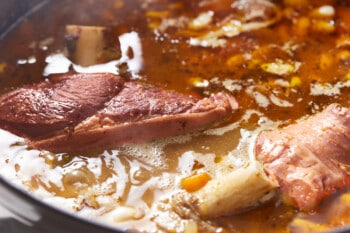 close up on pork cooking in soup