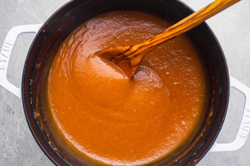 stirring apple butter in a pot