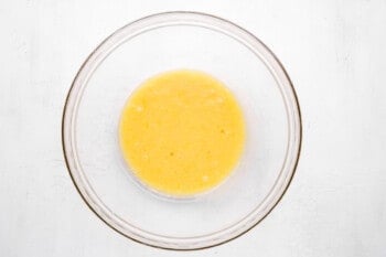 eggs, oil, and vanilla extract in a glass bowl.