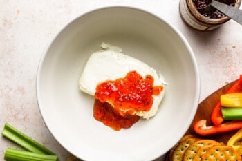 cream cheese and pepper jelly in a bowl