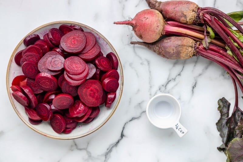 sliced beets in a white bowl.