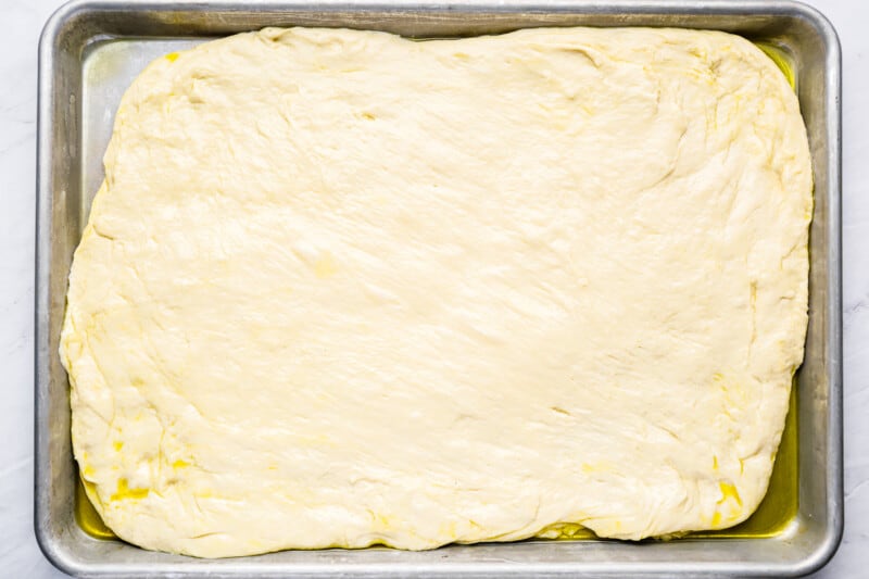 a square of dough in a baking pan.