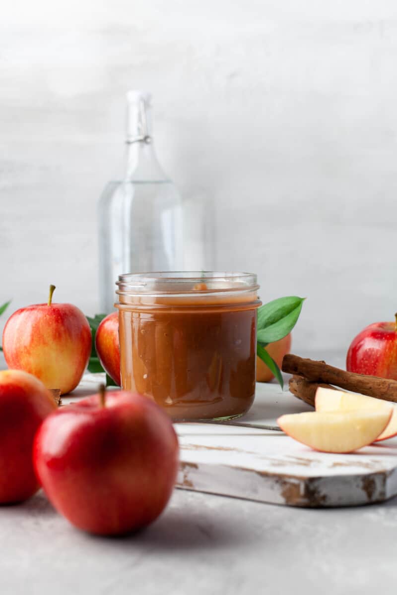 apple butter surrounded by apples