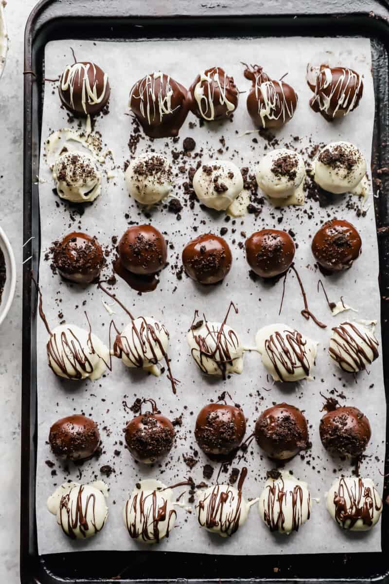 30 oreo balls on a parchment lined baking sheet.
