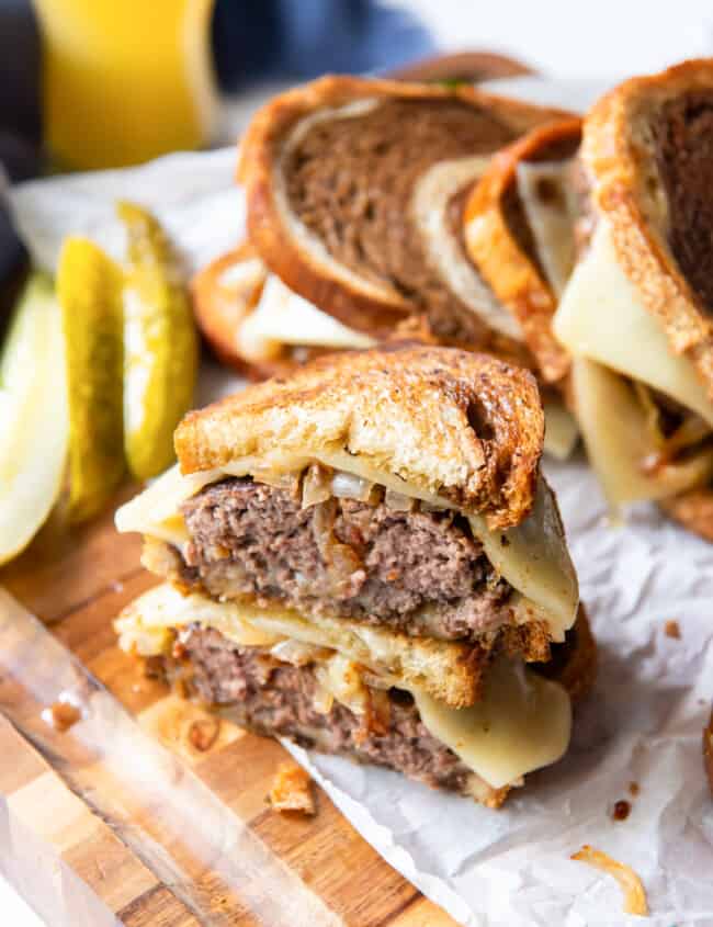patty melt cut in half and stacked up