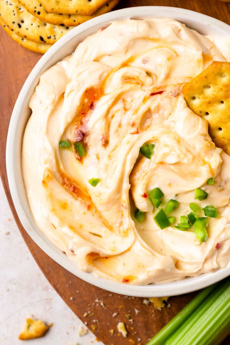 close up on a bowl of a cream cheese pepper jelly dip