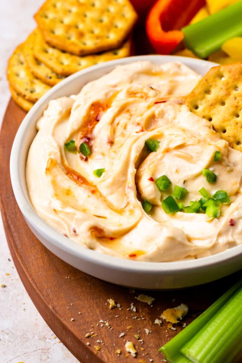 a bowl of creamy hot pepper jelly dip