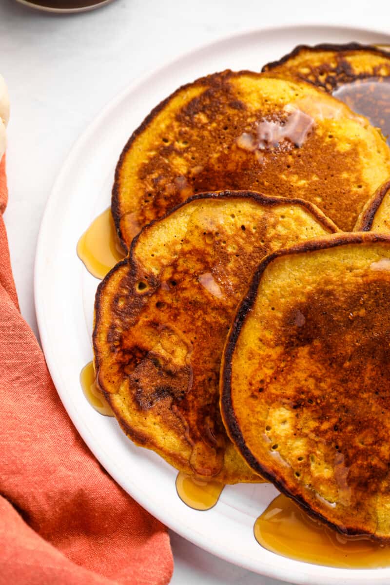 pumpkin pancakes covered in syrup