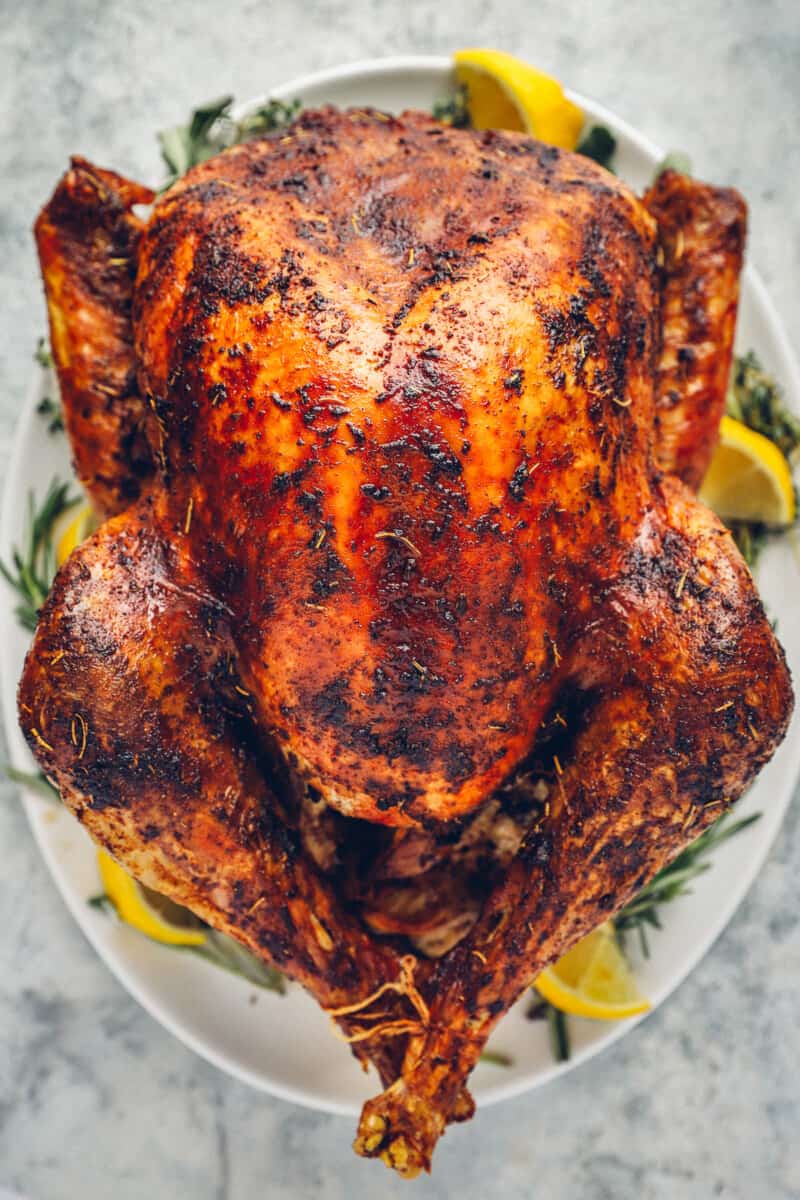 whole roasted thanksgiving turkey on a serving platter.
