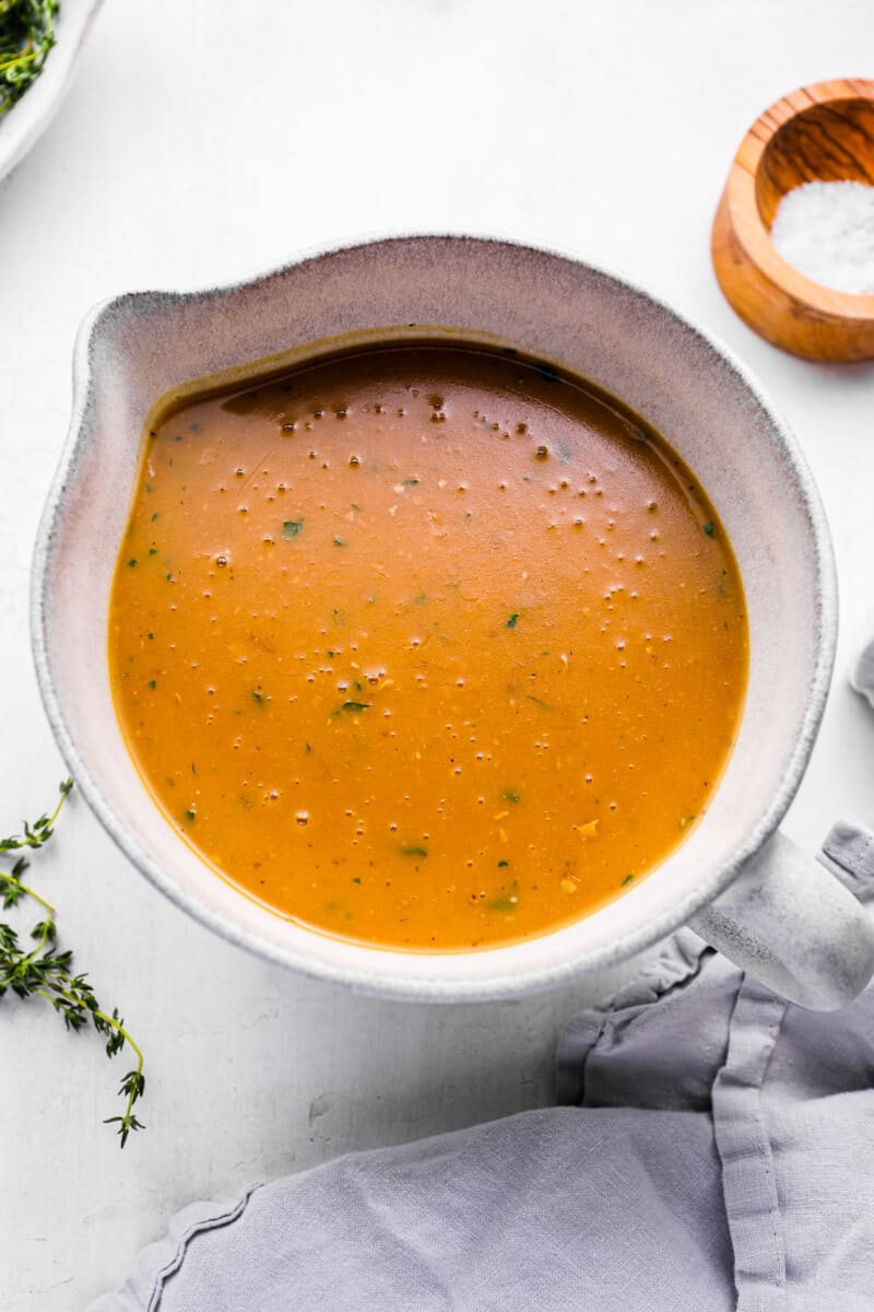 turkey gravy in a white gravy boat.