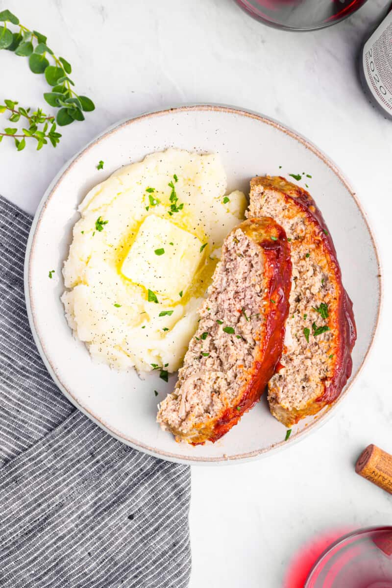 a plate of meatloaf and mashed potatoes