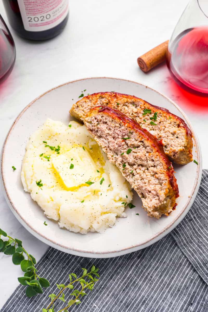 a plate of ground turkey meatloaf and mashed potatoes