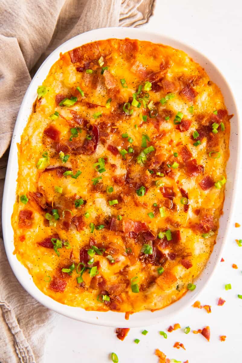 overhead view of a twice baked potato casserole in a white dish