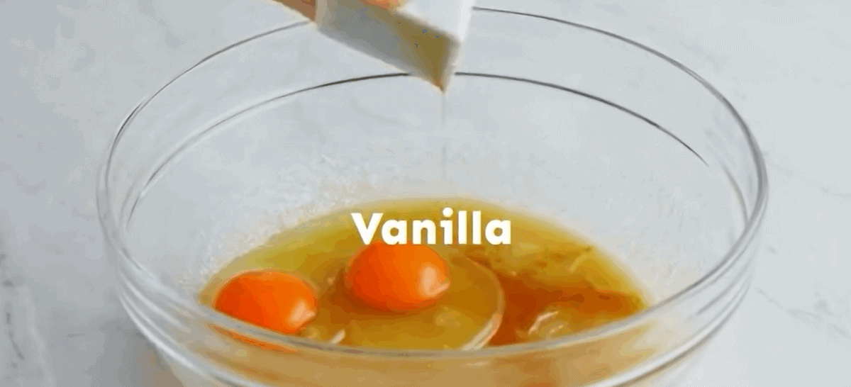 Adding eggs and vanilla to the sugar mixture.
