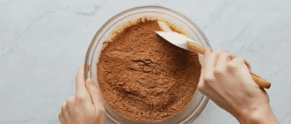 Combining the wet and the dry ingredients. 