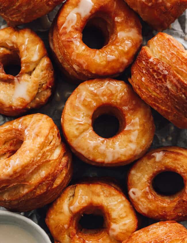 close up of 10 cronuts on a baking sheet.
