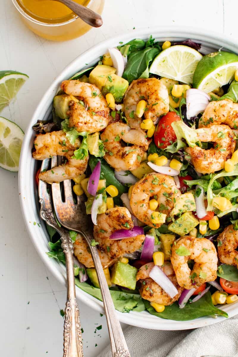 overhead view of a large bowl of grilled shrimp salad