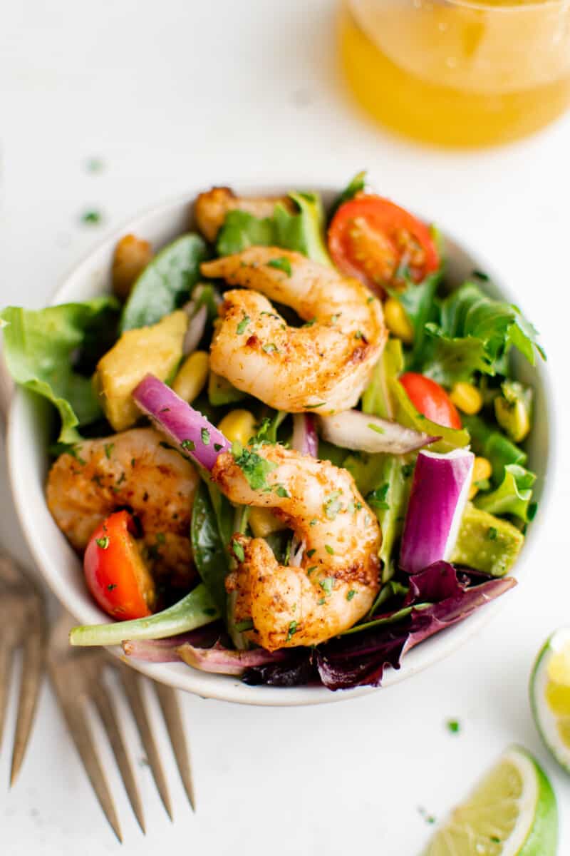 a bowl of grilled shrimp salad