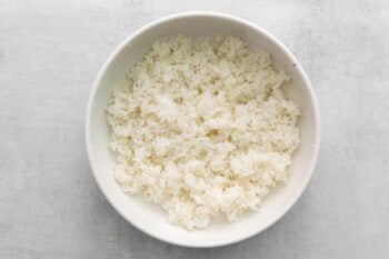 cooked seasoned rice in a white bowl.