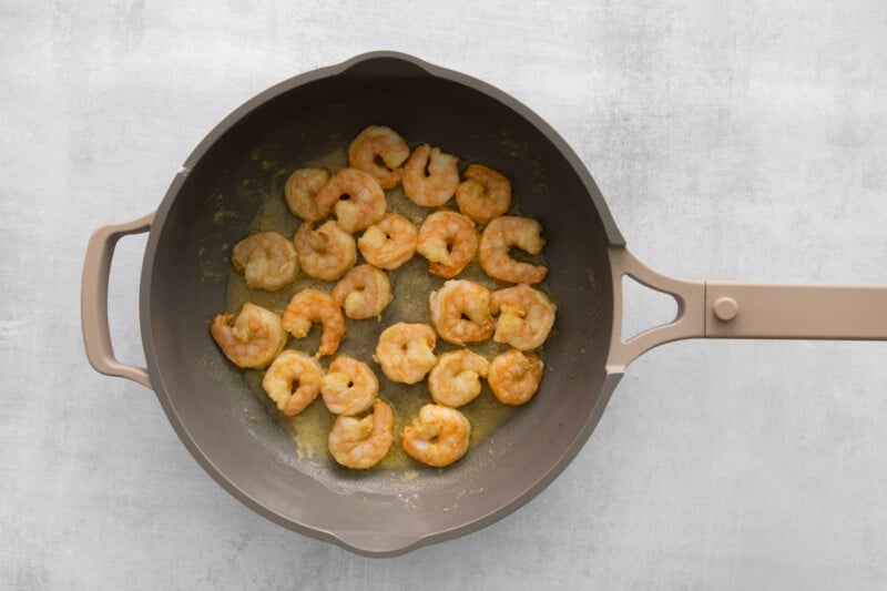 shrimp cooking in a frying pan.