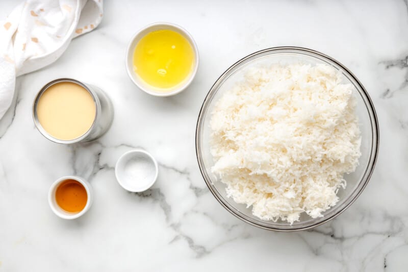 overhead view of ingredients for coconut macaroons in individual bowls.