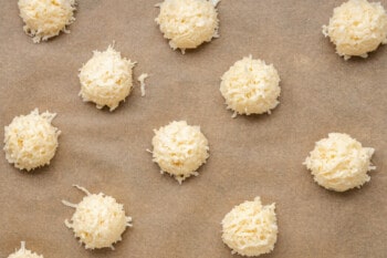 coconut macaroons arranged on parchment paper.