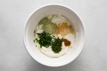 ingredients in a bowl on a white surface.