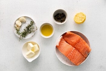 overhead view of ingredients for pan seared salmon in individual bowls.