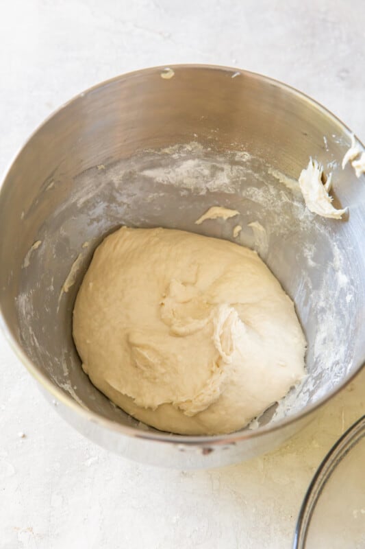 olive garden breadstick dough in a stainless mixing bowl.